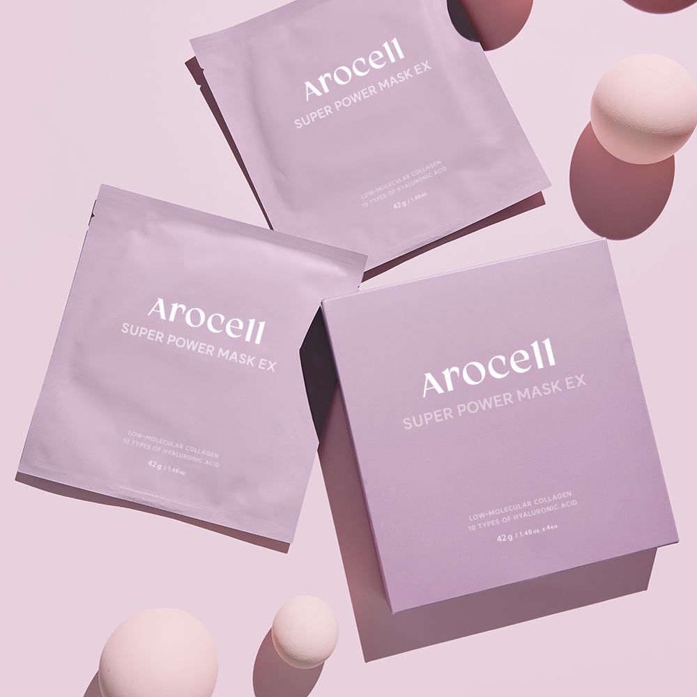 Sachets et boîte du Super Collagen Power Mask AROCELL présentés sur un fond violet